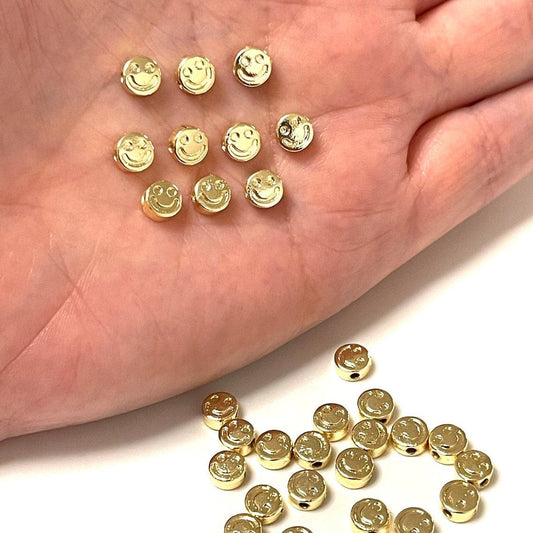 Vergoldetes Werkzeug aus Messing mit lächelndem Gesicht